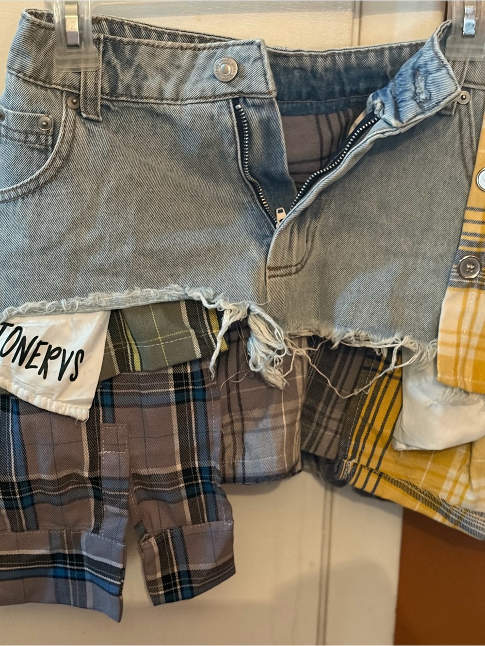 Women’s Asymmetrical Distressed Denim Plaid Patch Skirt -